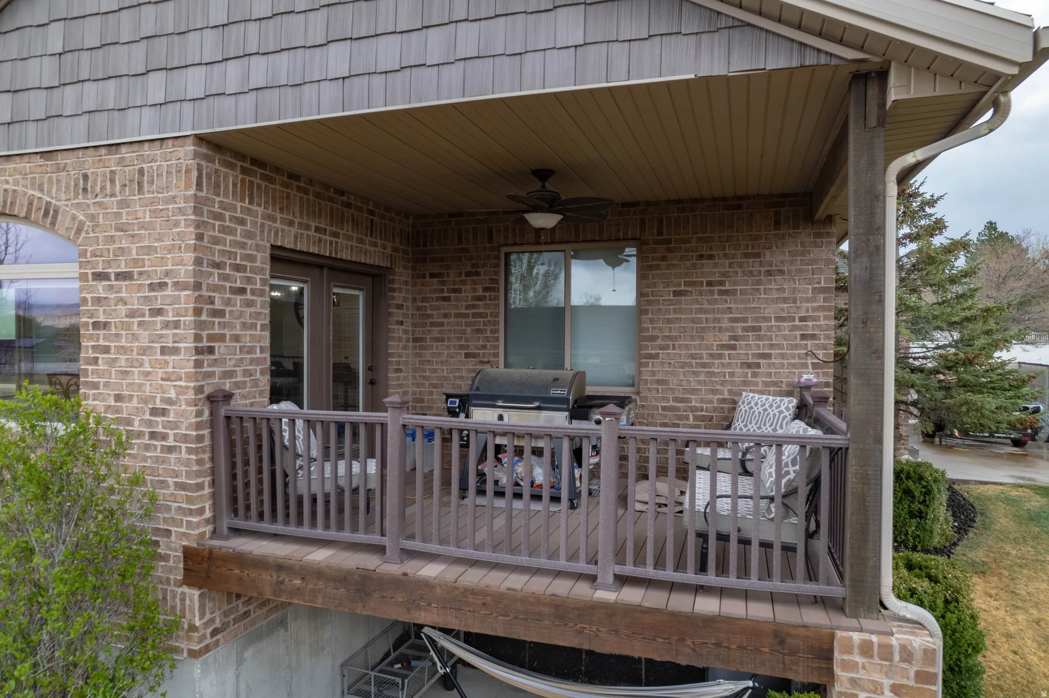 Wooden terrace with a ceiling fan