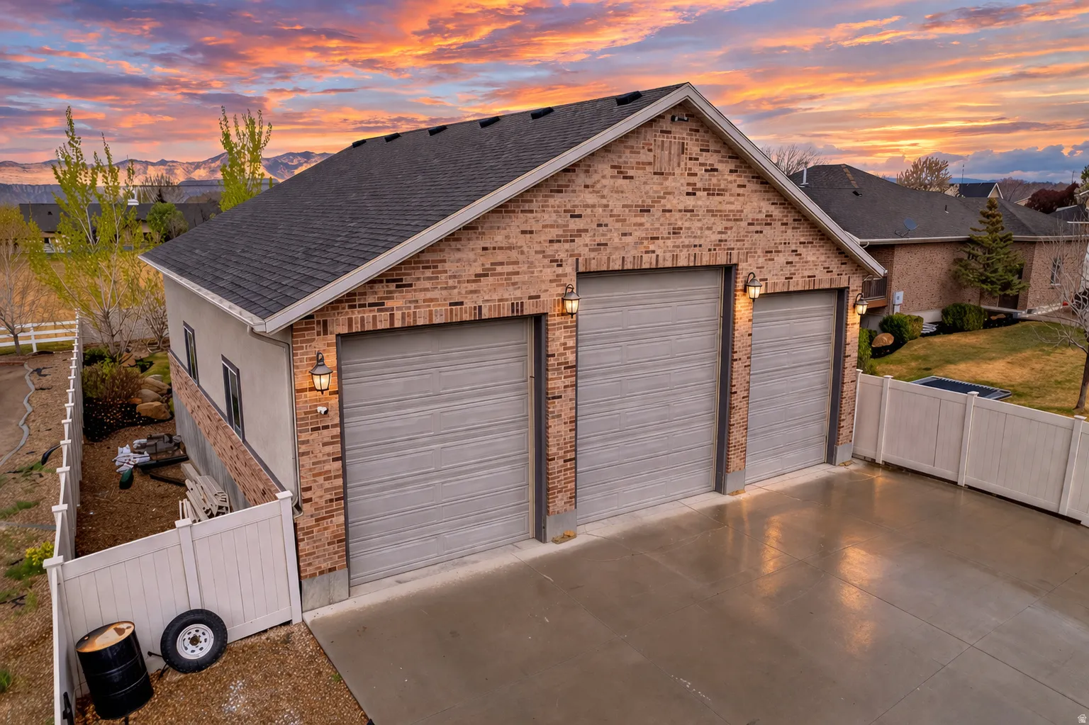View of garage at dusk