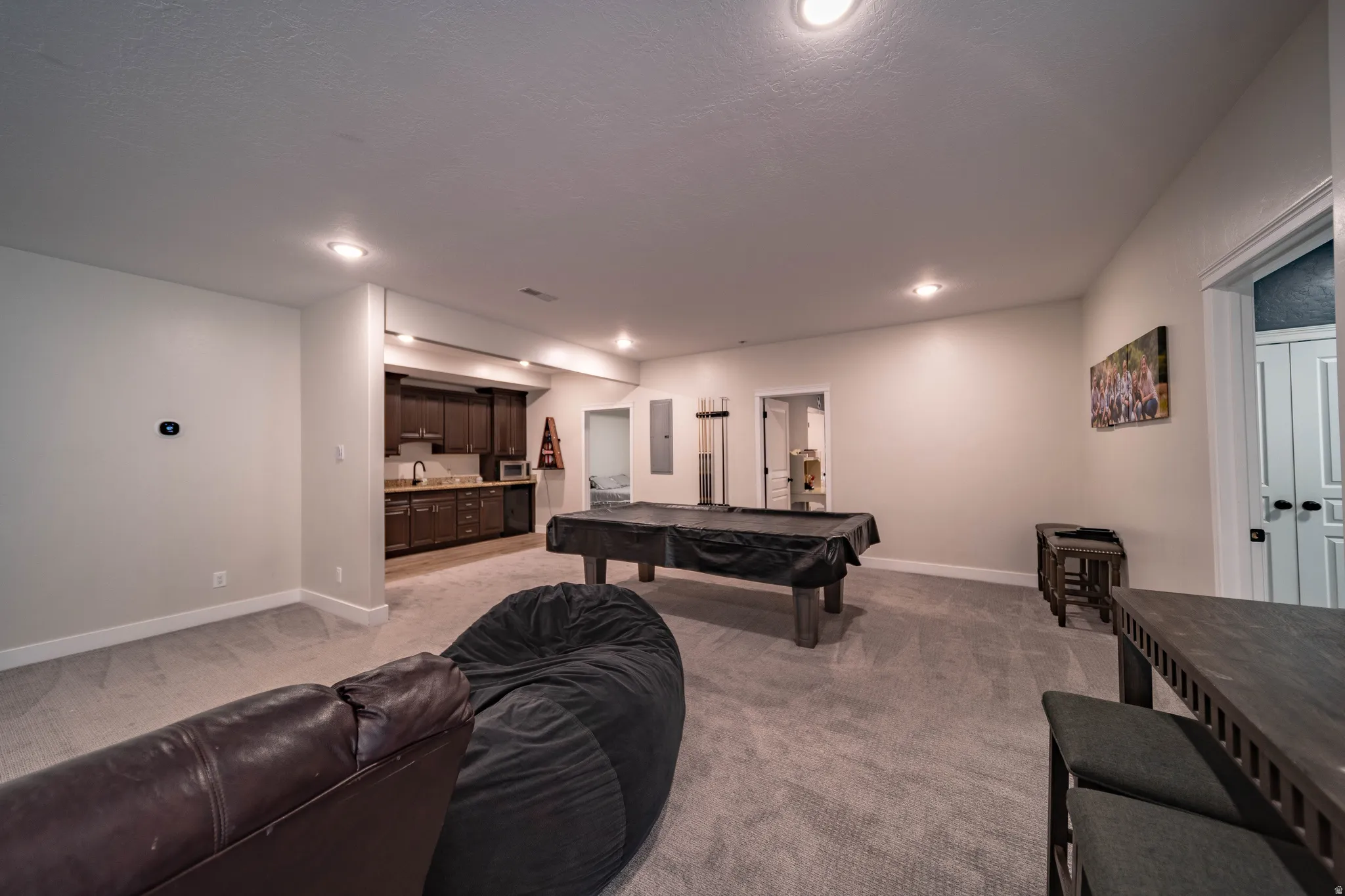 Game room with light carpet, pool table, and recessed lighting