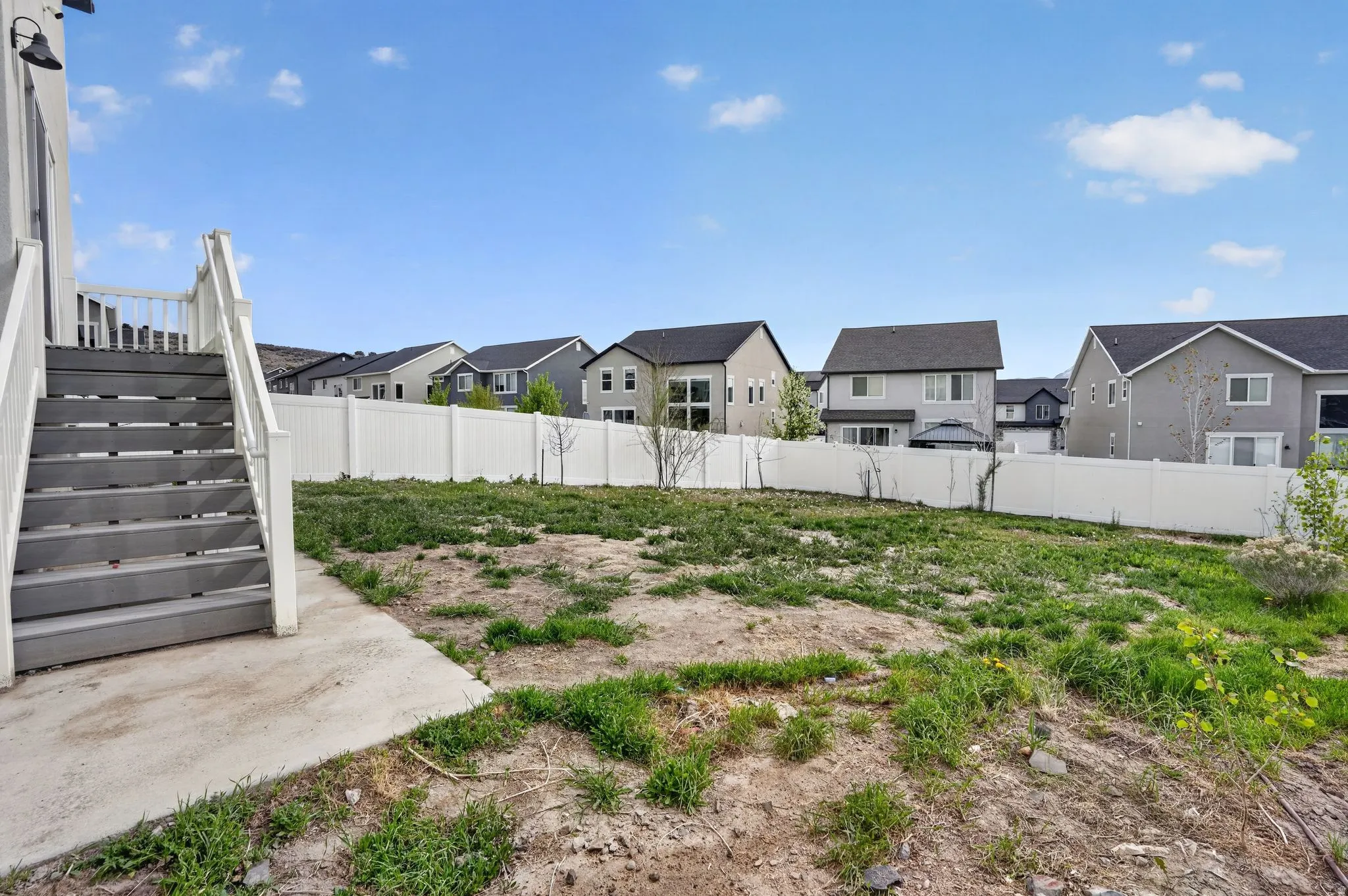 Fenced backyard featuring a residential view and a patio