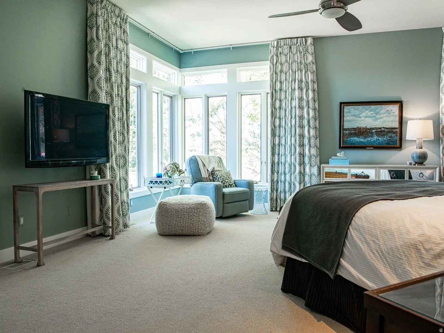 Master Bedroom, plush carpeting with a ceiling fan, auto draperies, and fireplace.