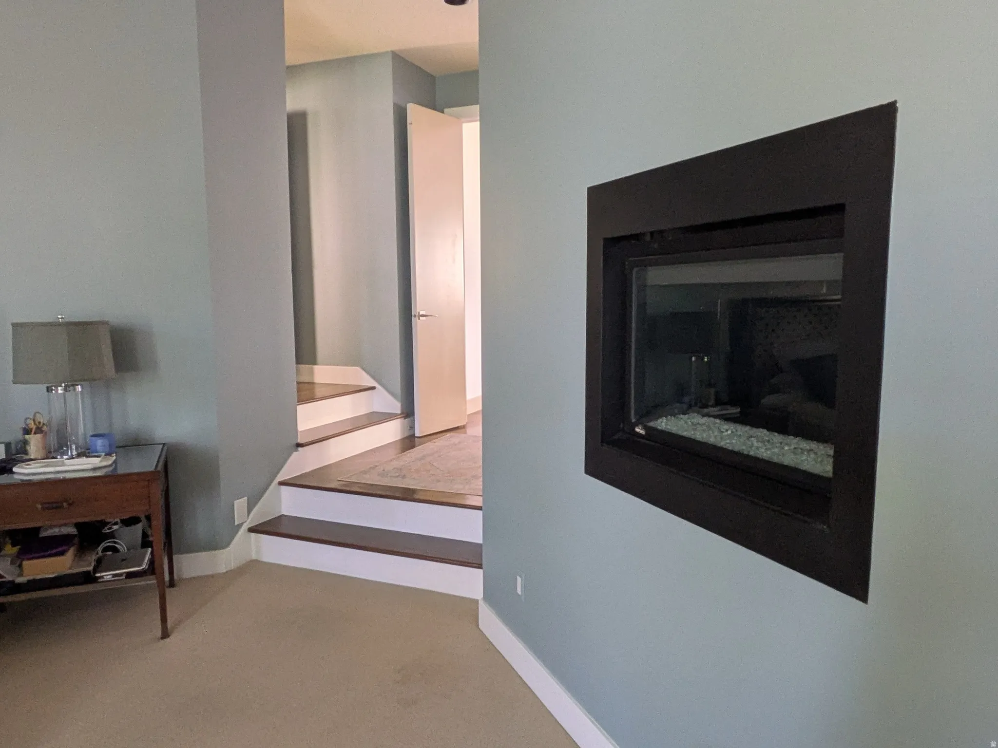 Master Bedroom with fireplace and corridor to master bathroom