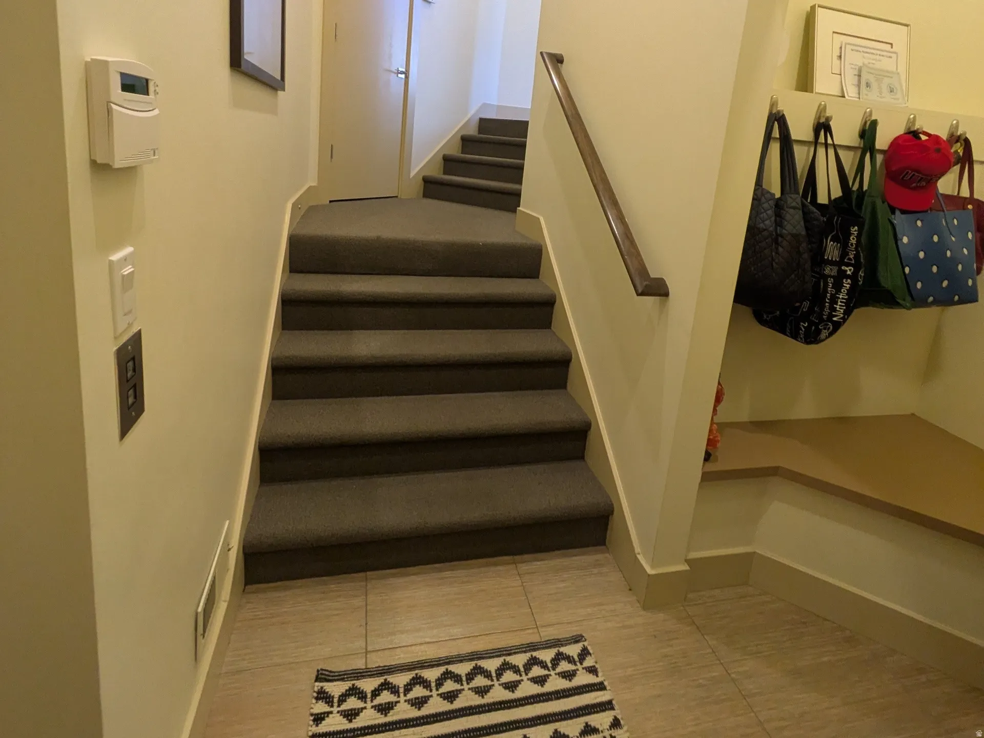 Stairway from garage and mudroom