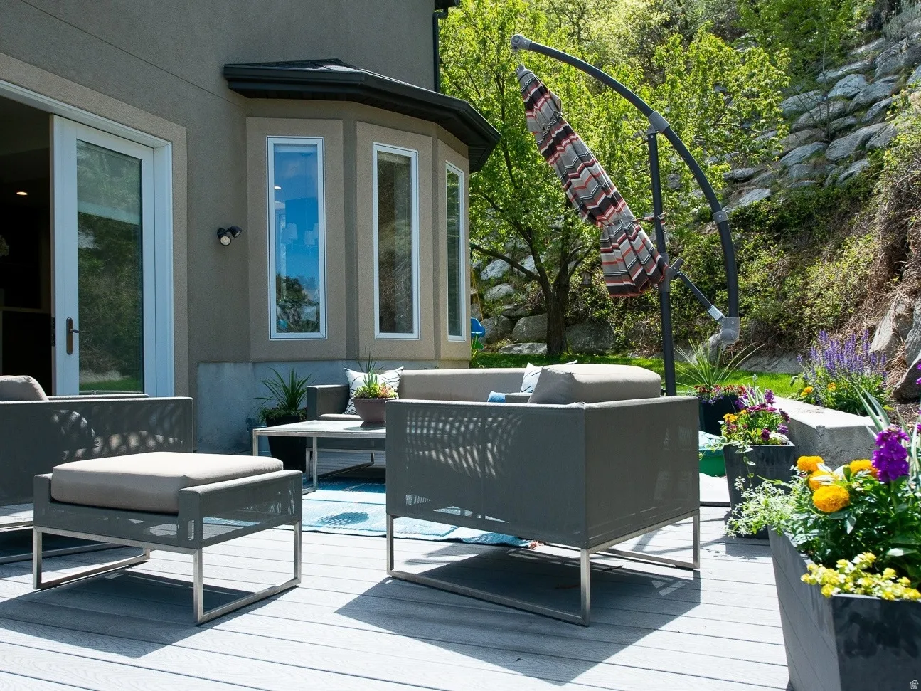 Wooden patio terrace for outdoor living space from family room.