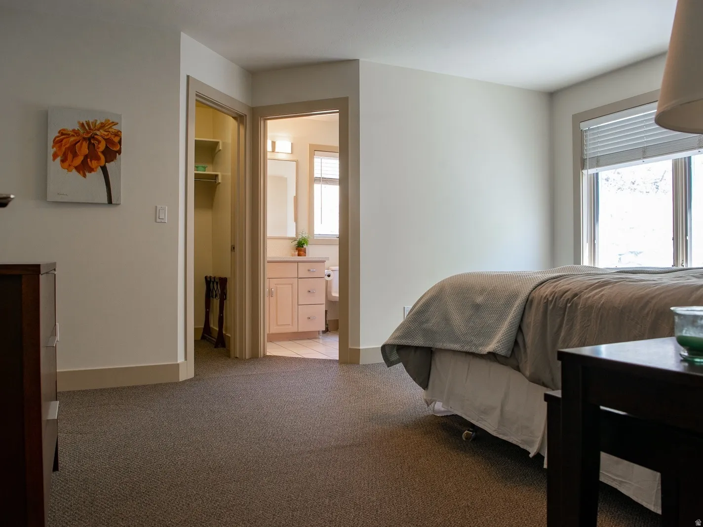 Bedroom with a walk in closet, and ensuite bathroom