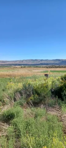 View of mountain background featuring rural landscape