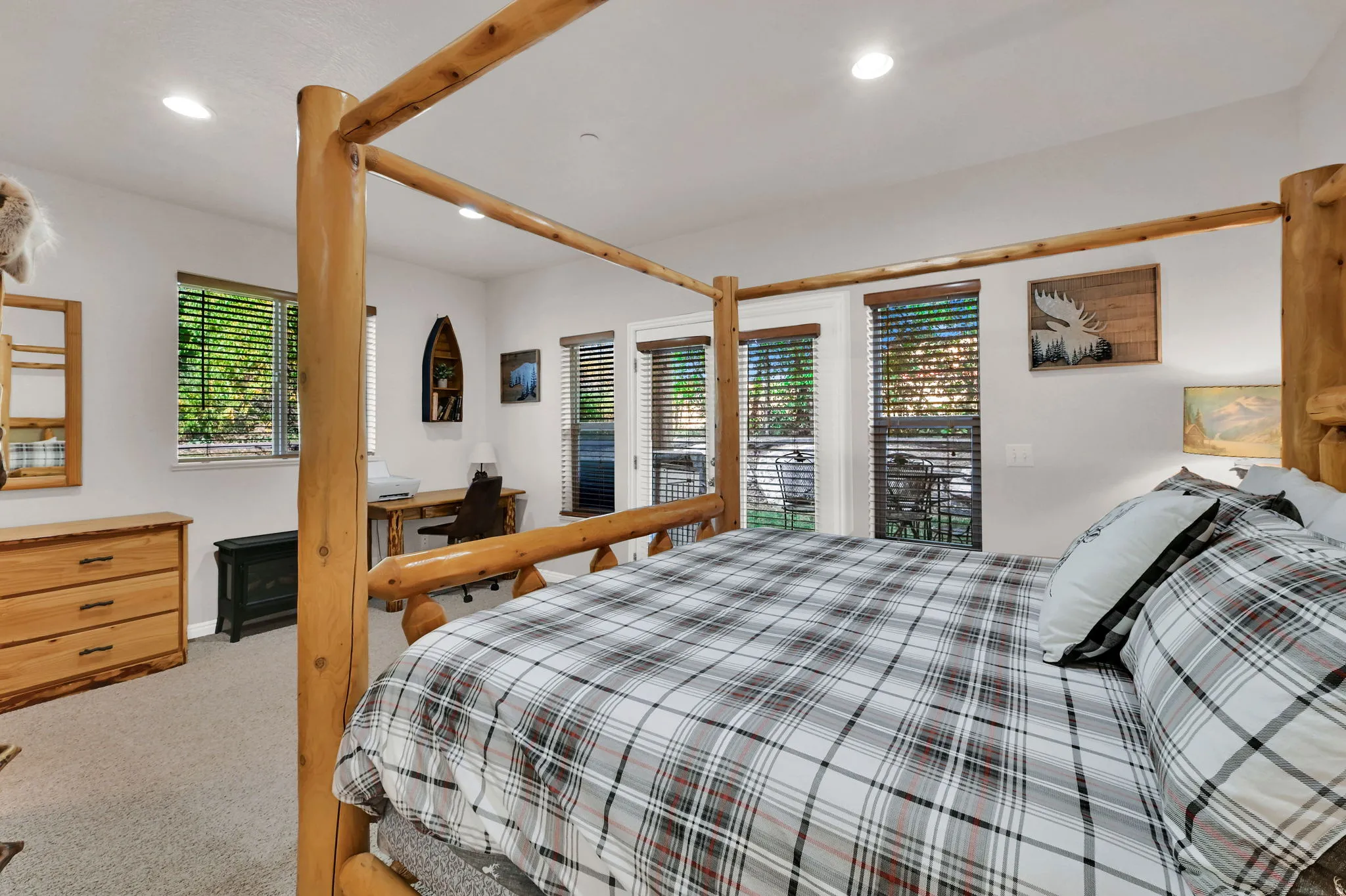 Bedroom featuring light carpet, recessed lighting, and access to outside