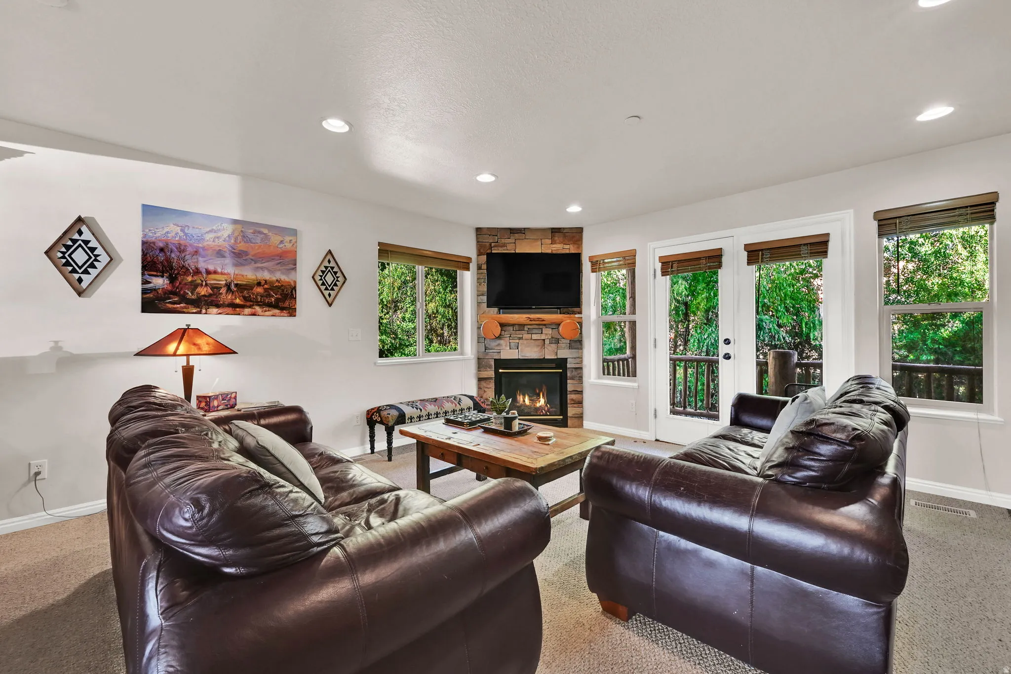 Living room with carpet flooring, a fireplace, and recessed lighting