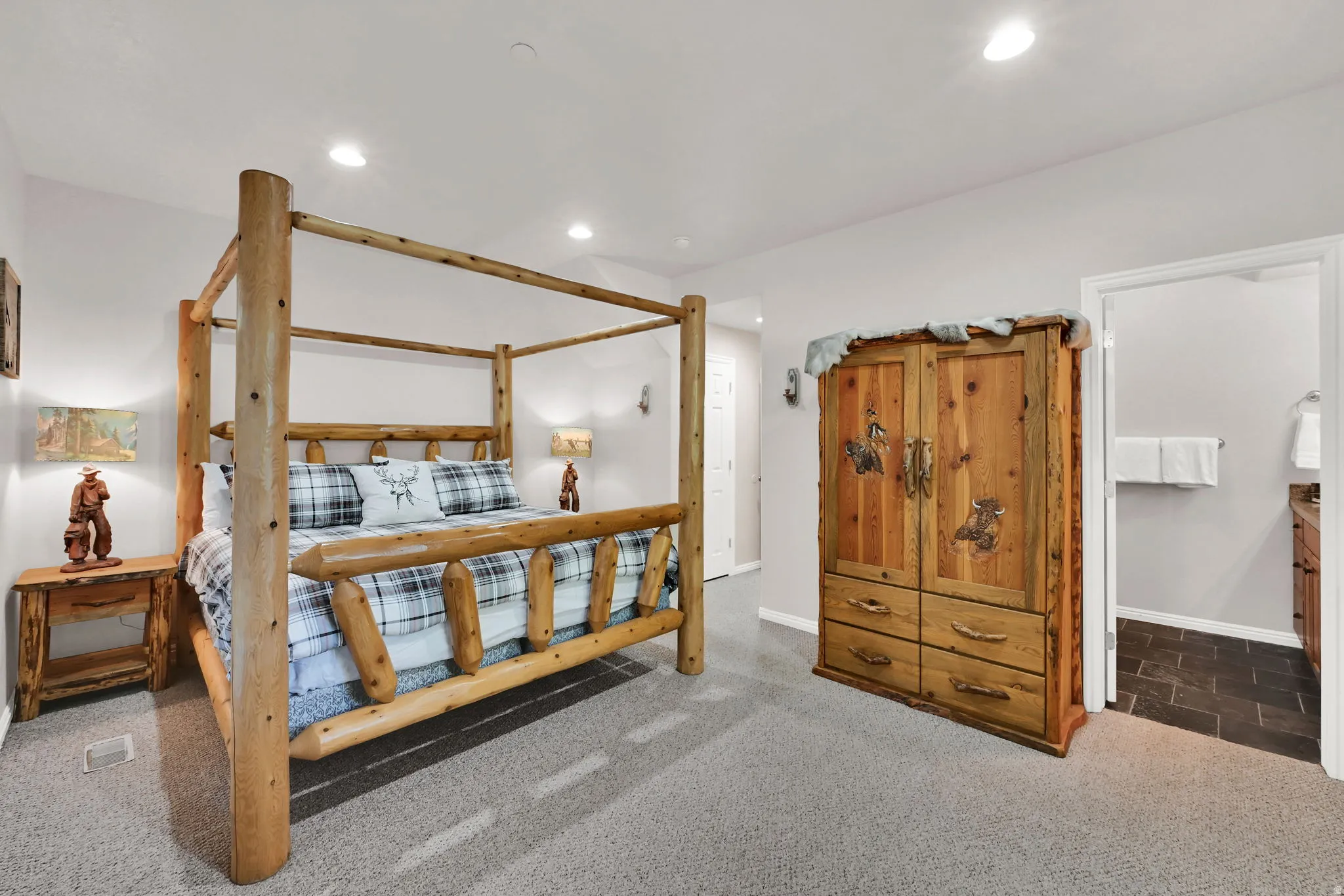 Bedroom with dark carpet and recessed lighting