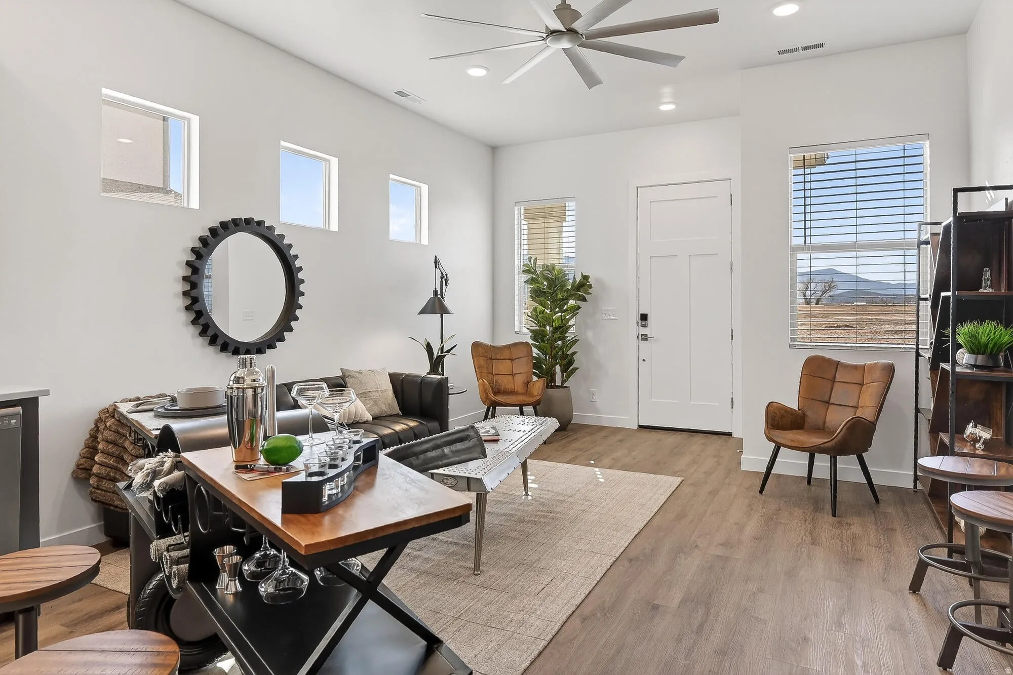 Living area with ceiling fan, recessed lighting, and light wood-style floors