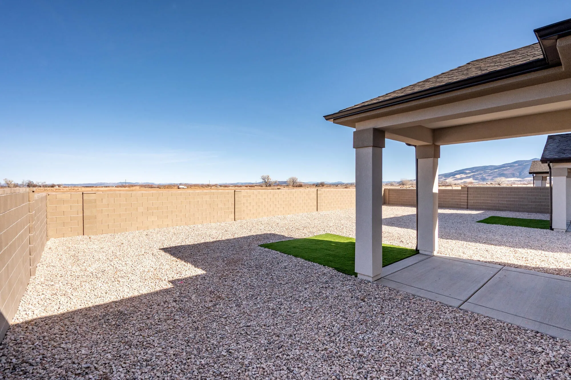 Fenced backyard with a patio area and a mountain view