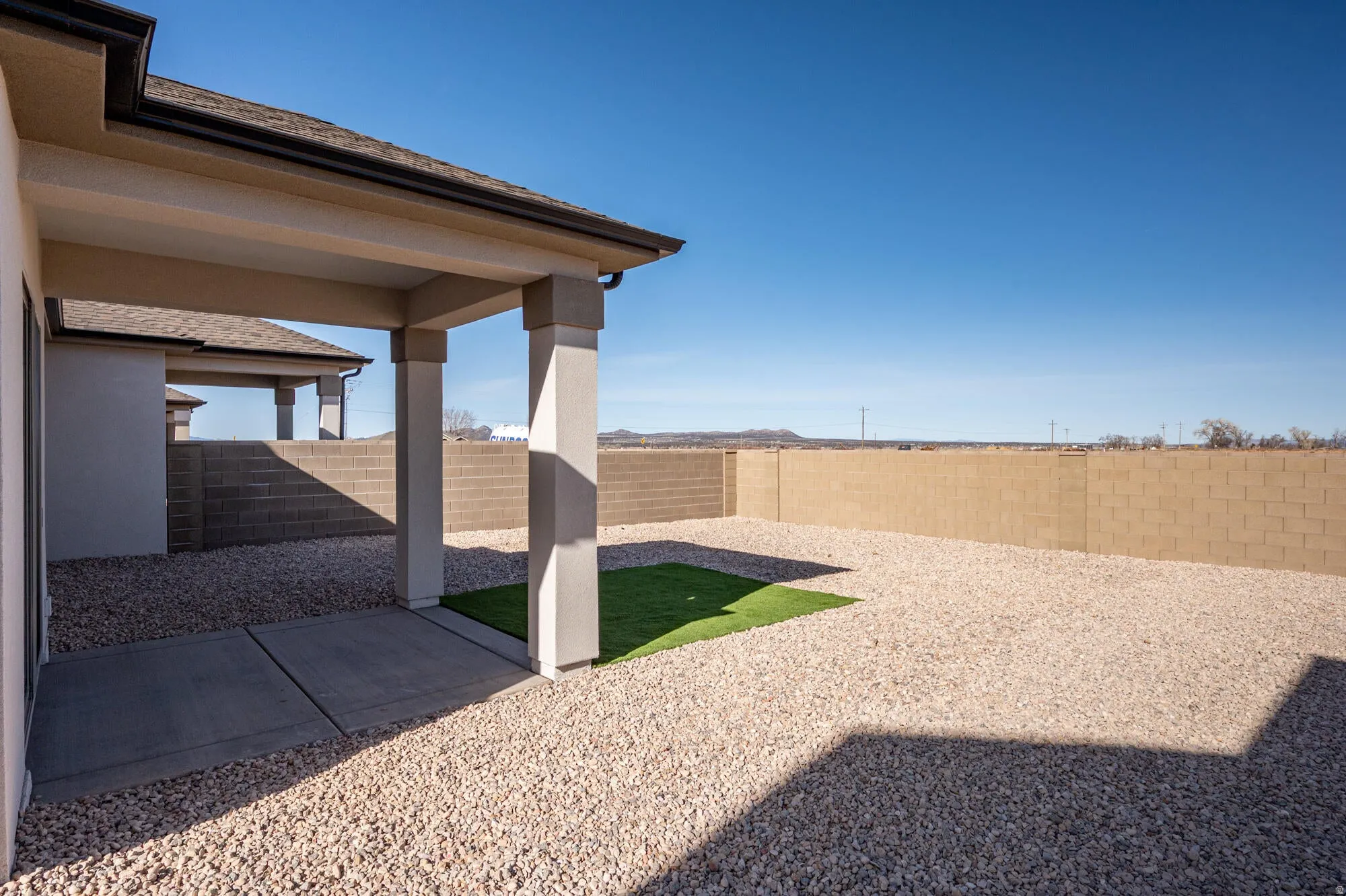 Fenced backyard featuring a patio