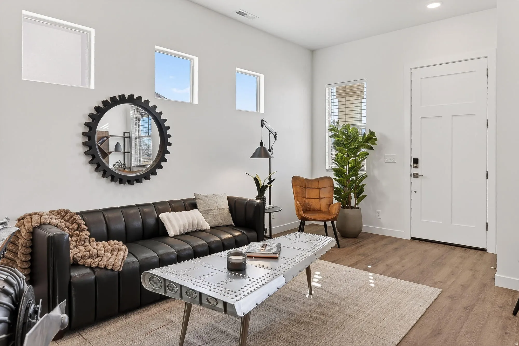 Living area featuring light wood-type flooring and baseboards
