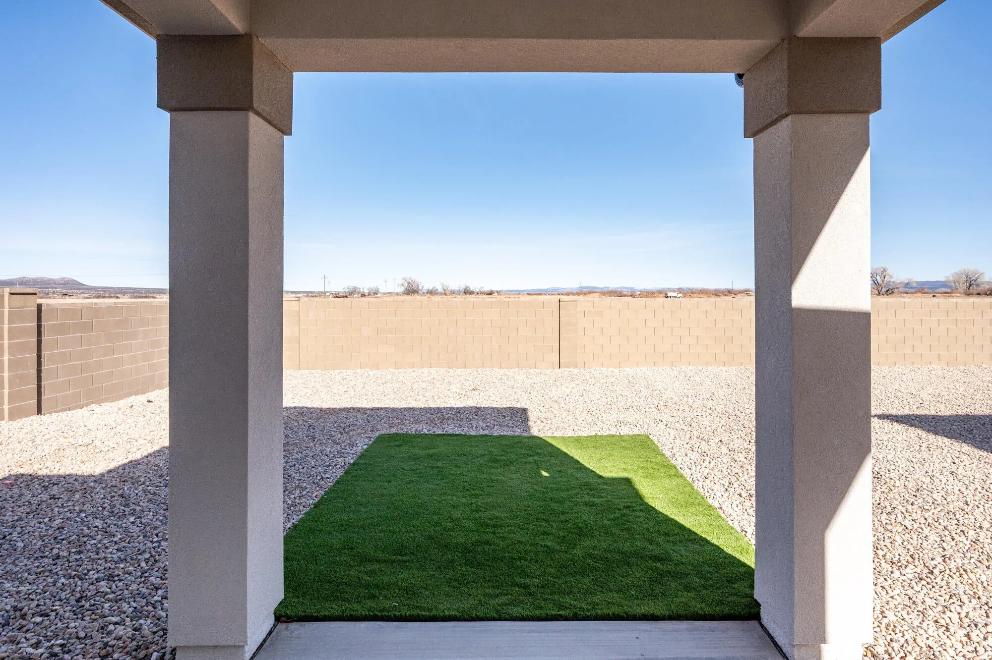 Fenced backyard featuring a patio