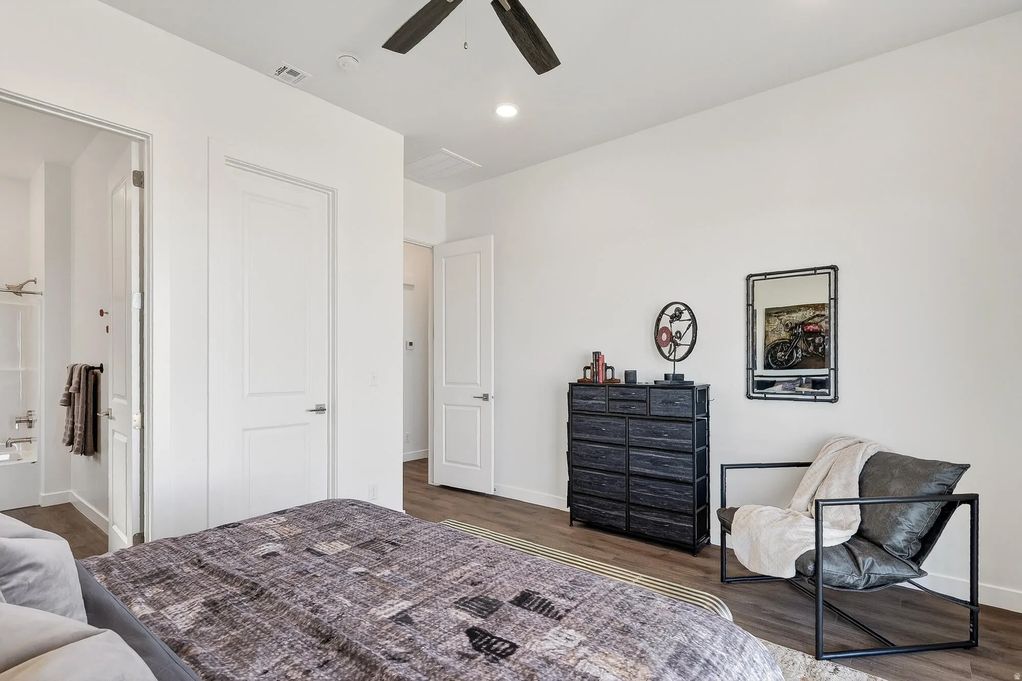 Bedroom with dark wood finished floors, recessed lighting, a ceiling fan, and ensuite bathroom