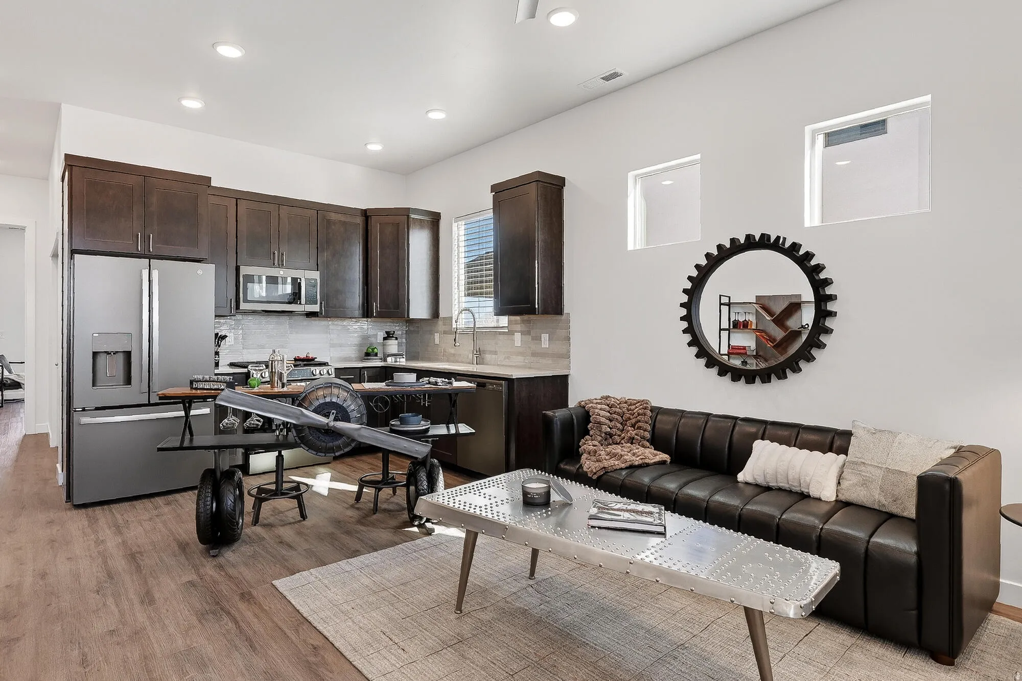 Living area featuring light wood-type flooring and recessed lighting