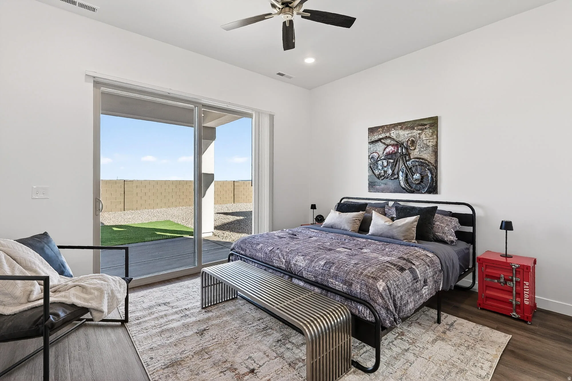 Bedroom with access to exterior, a ceiling fan, wood finished floors, and recessed lighting
