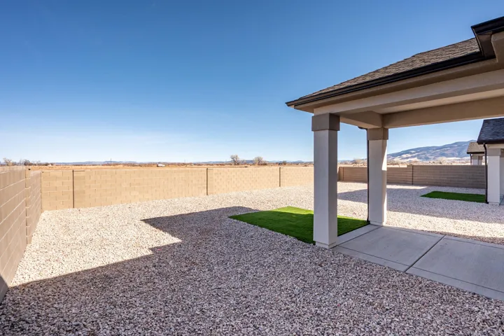 Fenced backyard with a patio area and a mountain view