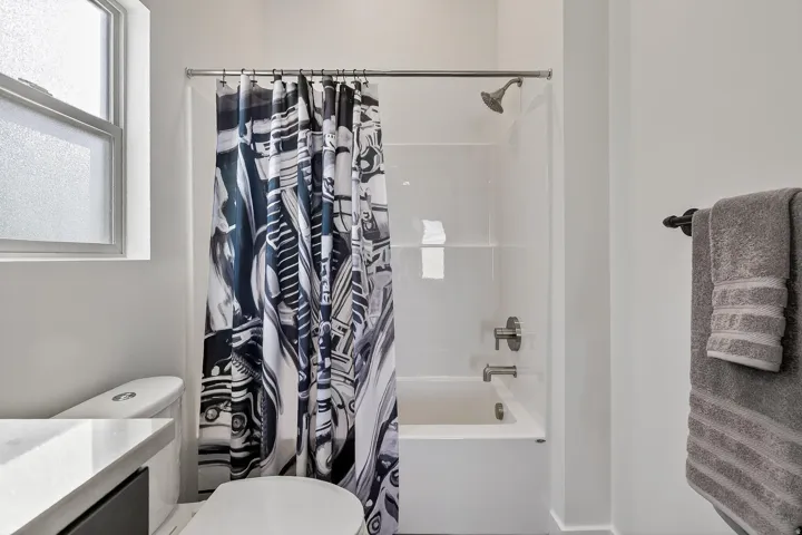 Bathroom with vanity and shower / tub combo