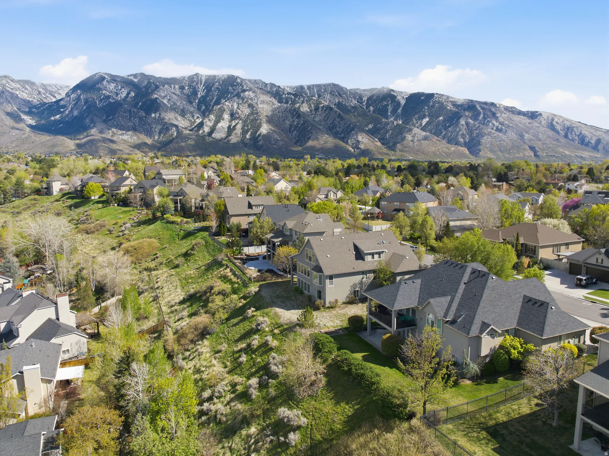 Aerial view of residential area with a mountain backdrop
