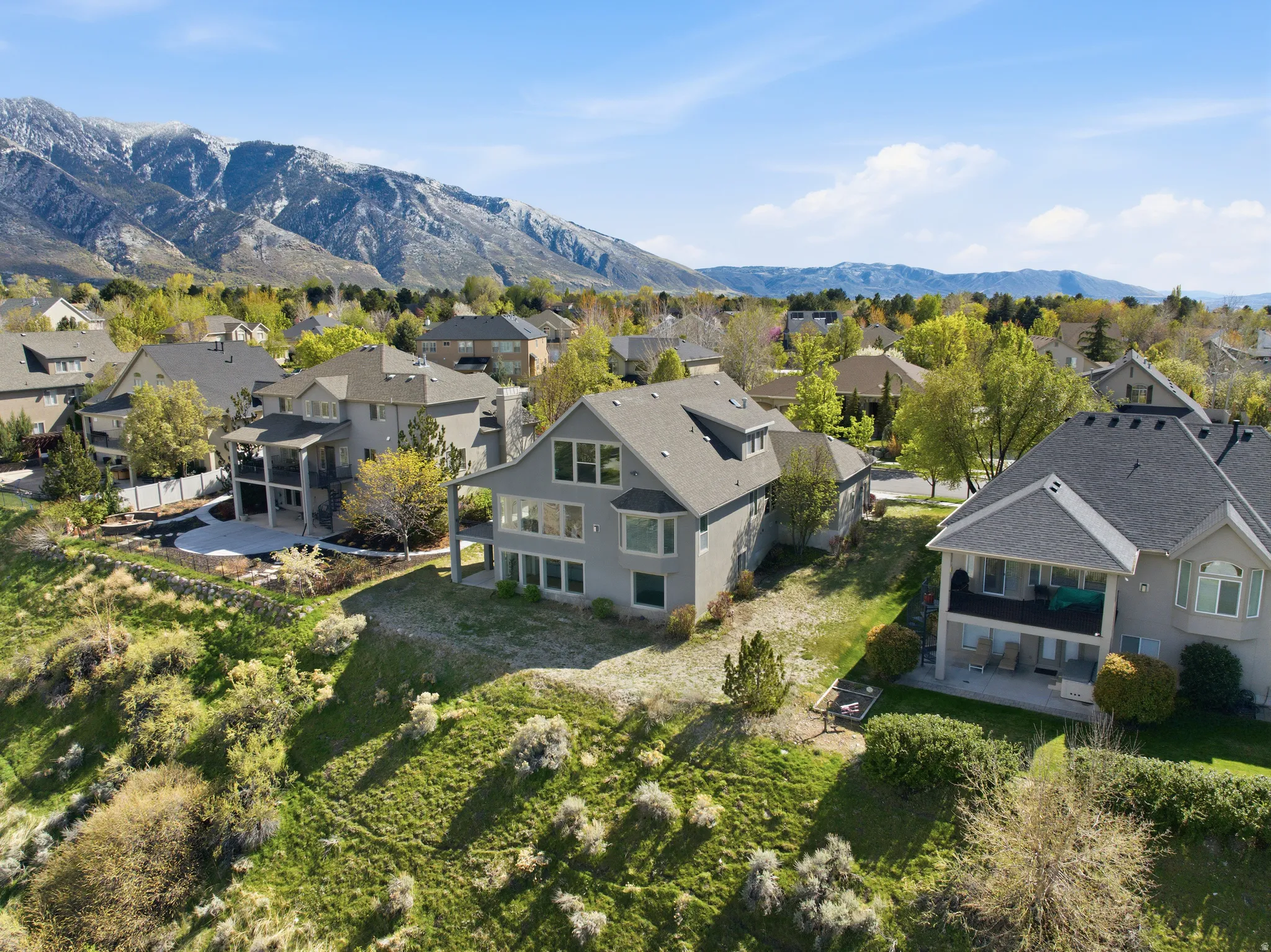 Aerial view of residential area featuring mountains