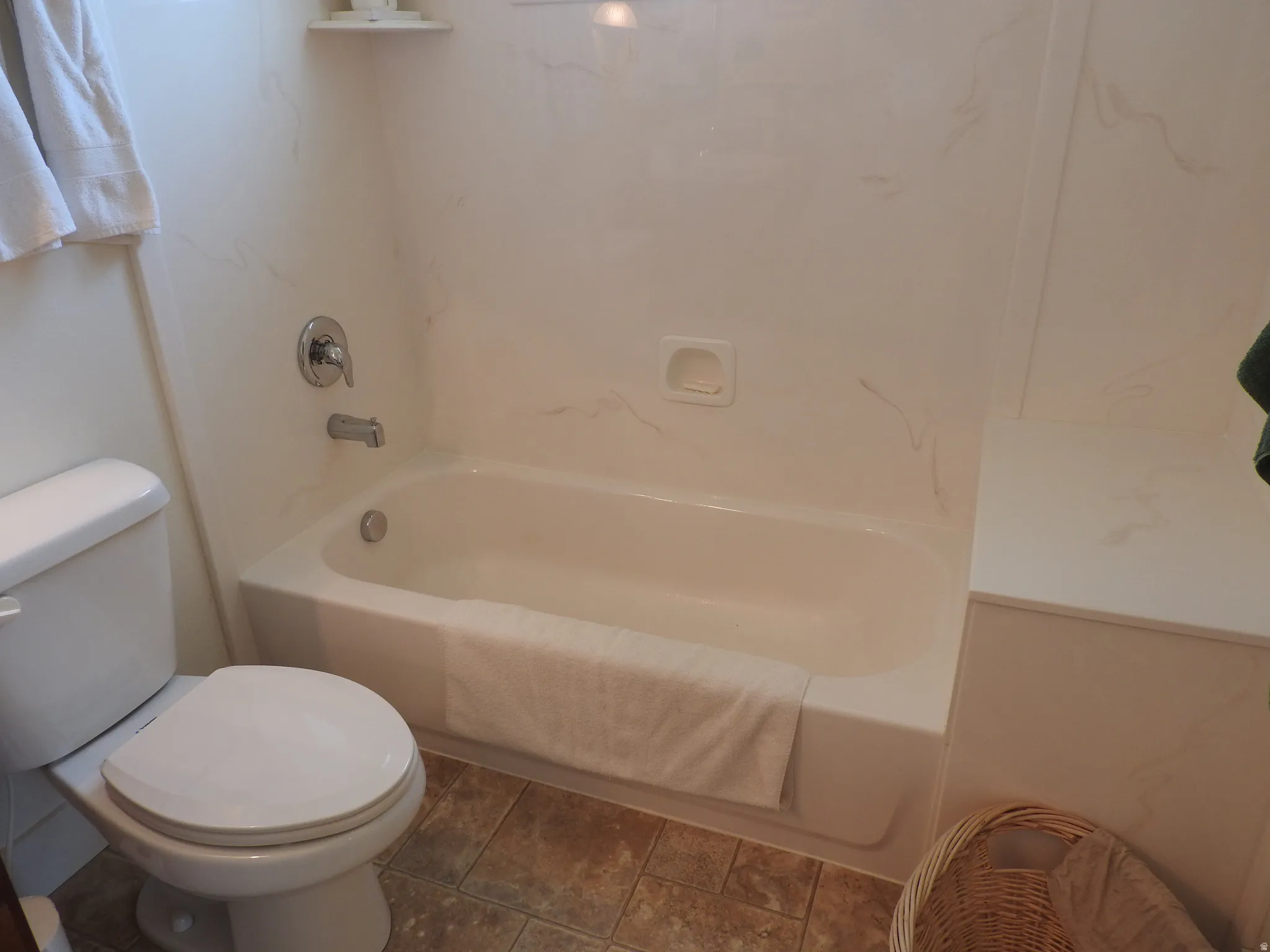 Bathroom with shower / washtub combination