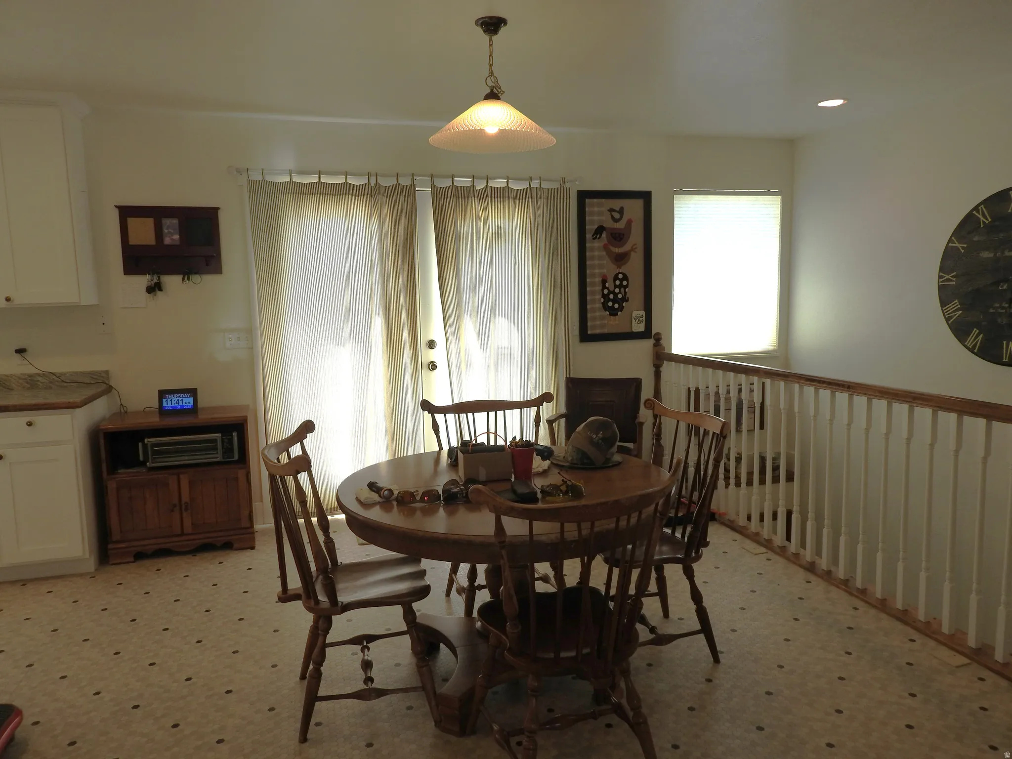 Dining space with light flooring and recessed lighting