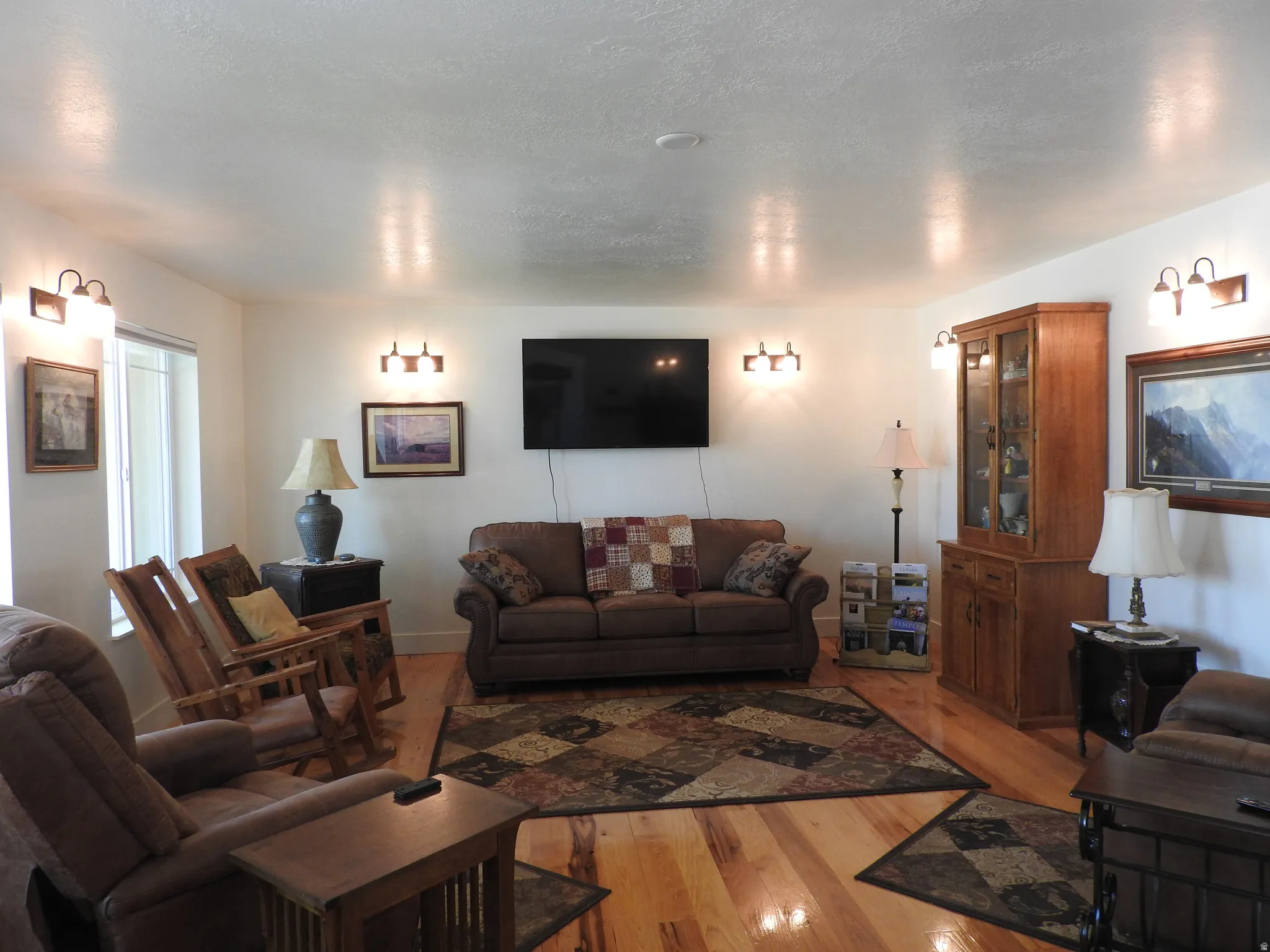 Living area with hardwood / wood-style floors