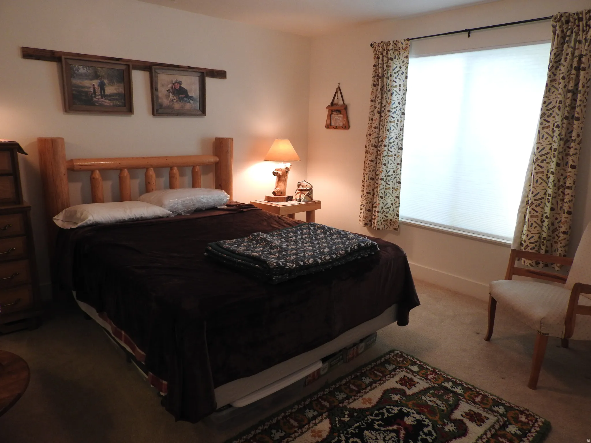 Carpeted bedroom featuring baseboards