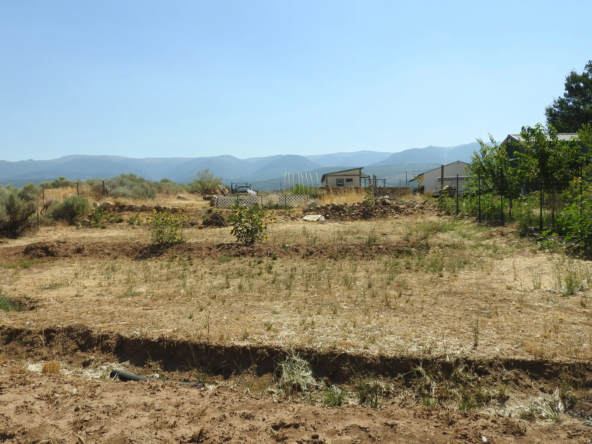 View of mountain backdrop featuring rural landscape