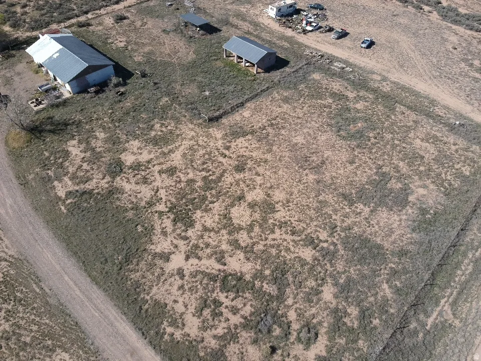 Aerial view of property and surrounding area with rural landscape
