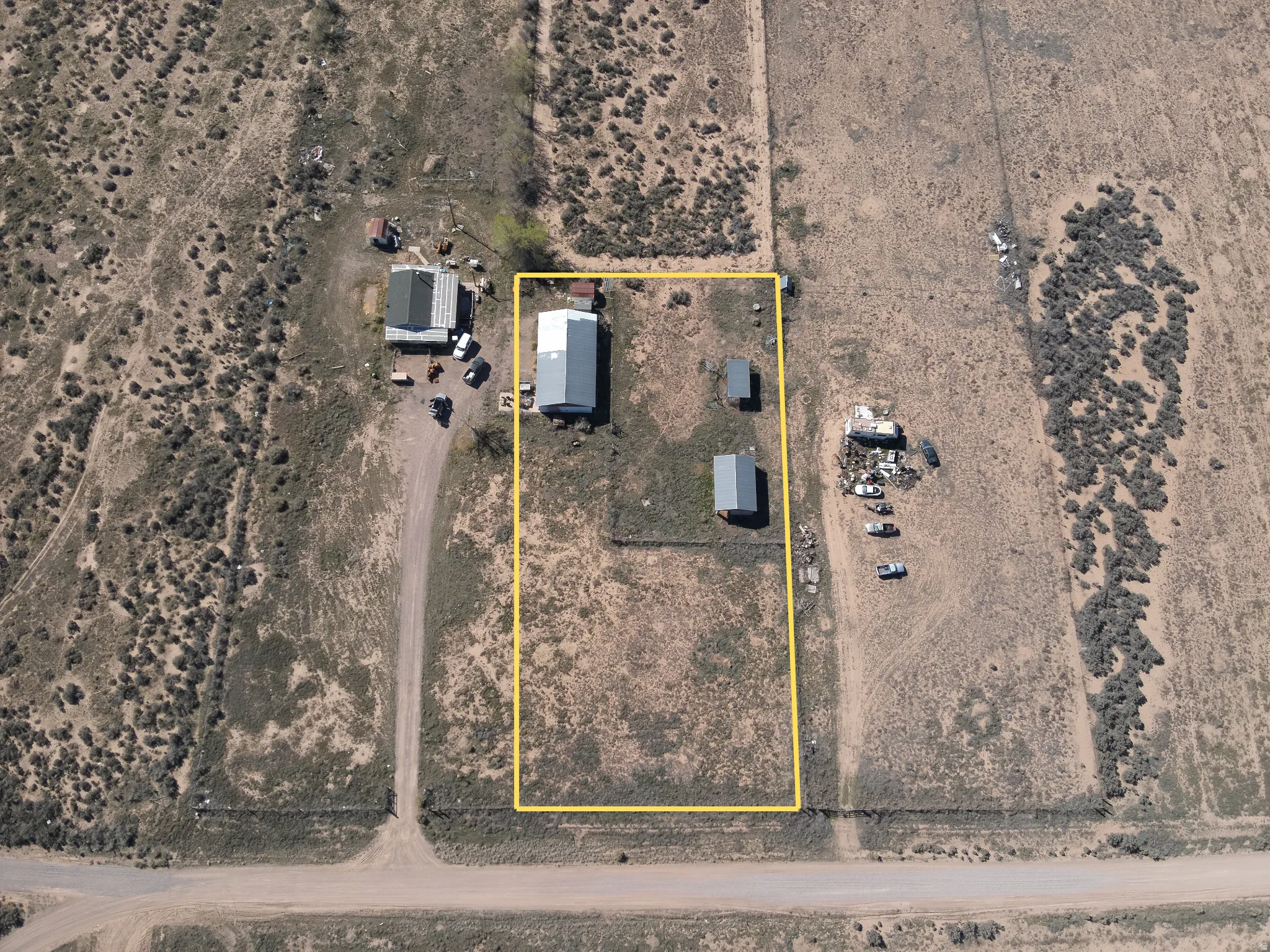 View of rural area with property boundaries highlighted and a desert landscape. Lines are approximate