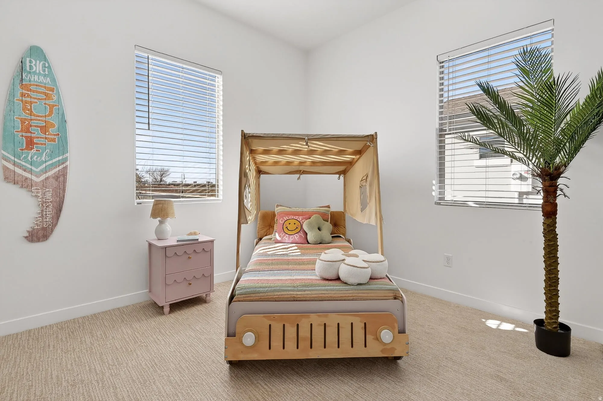 Carpeted bedroom featuring baseboards