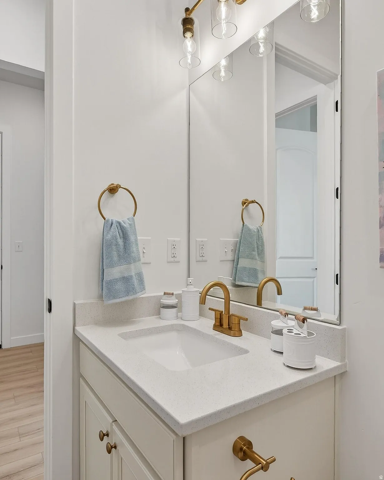 Bathroom with vanity and light wood-type flooring