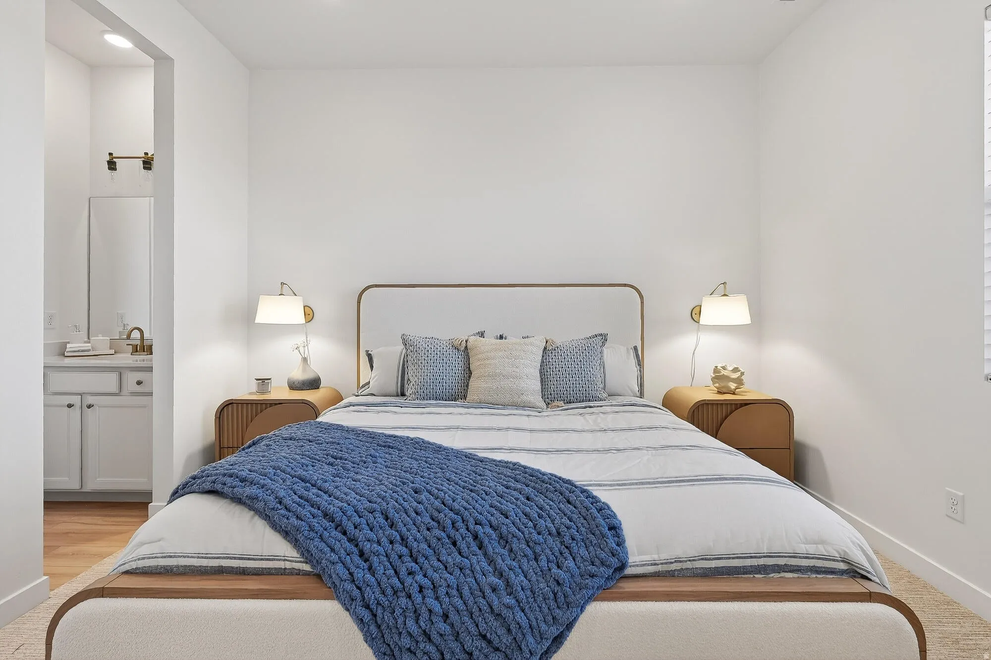 Bedroom with ensuite bathroom and baseboards