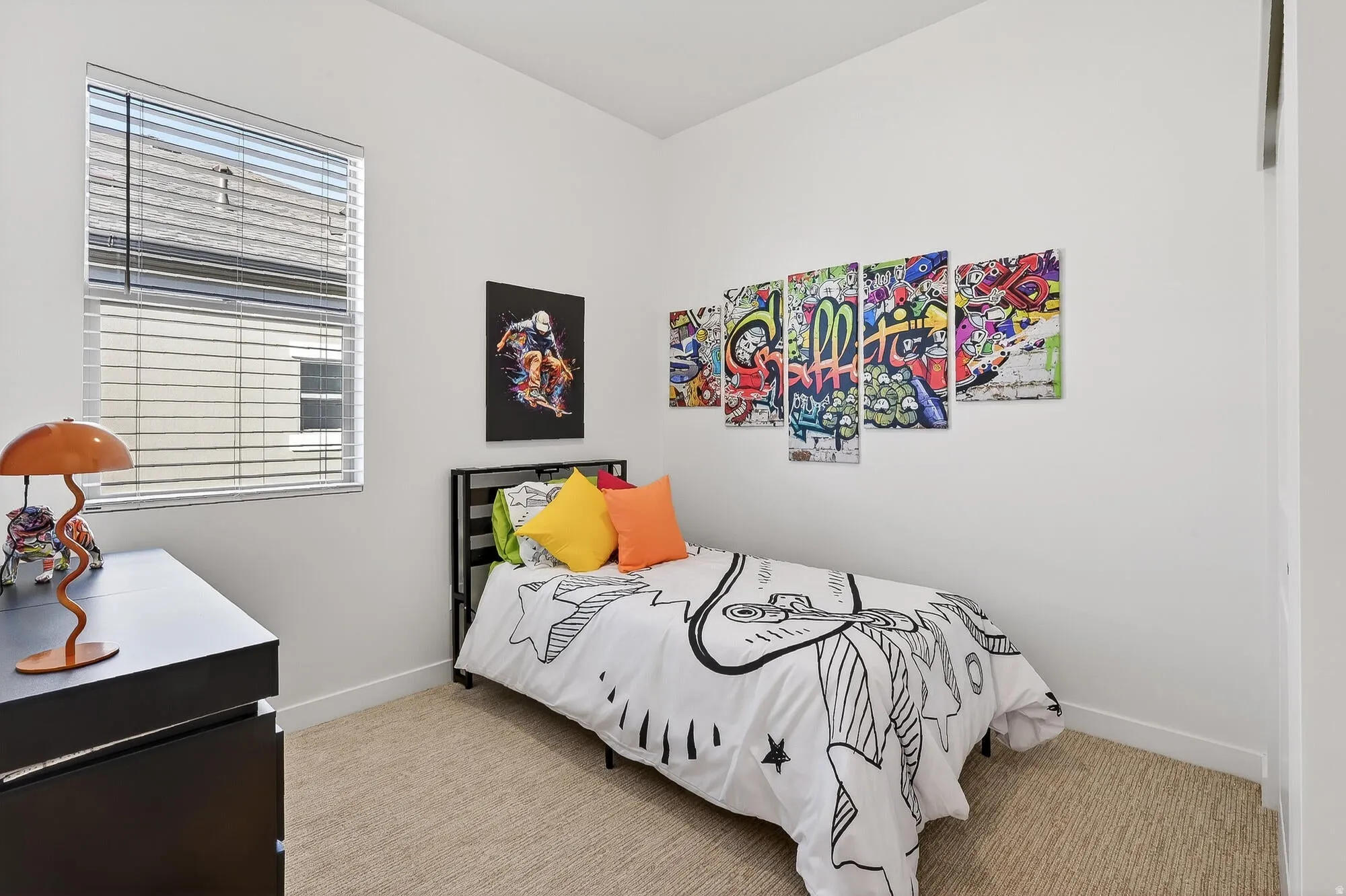 Bedroom featuring baseboards and light colored carpet