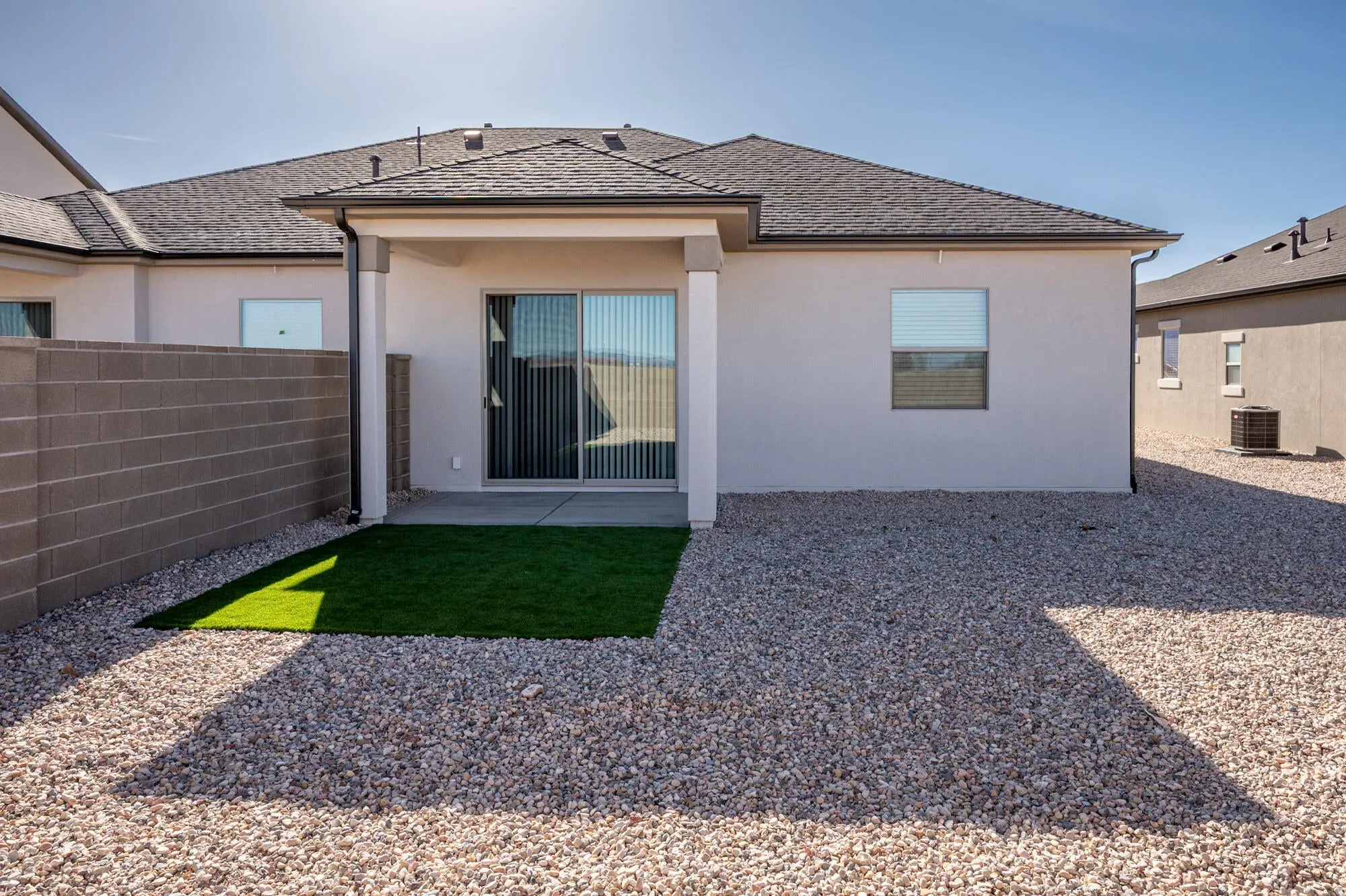Rear view of house featuring a patio and stucco siding