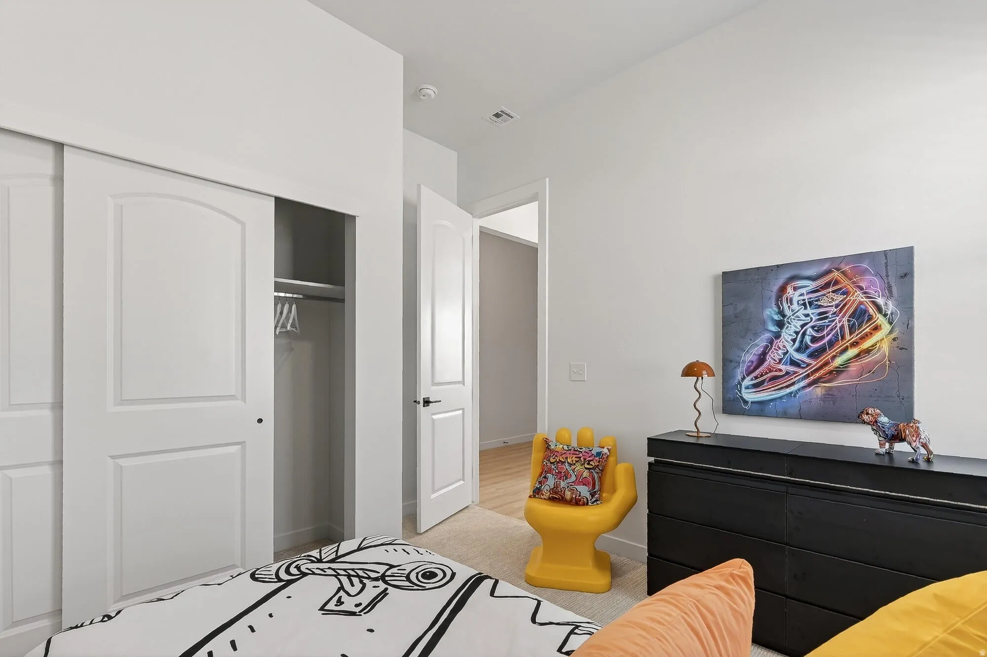 Bedroom featuring a closet and light colored carpet