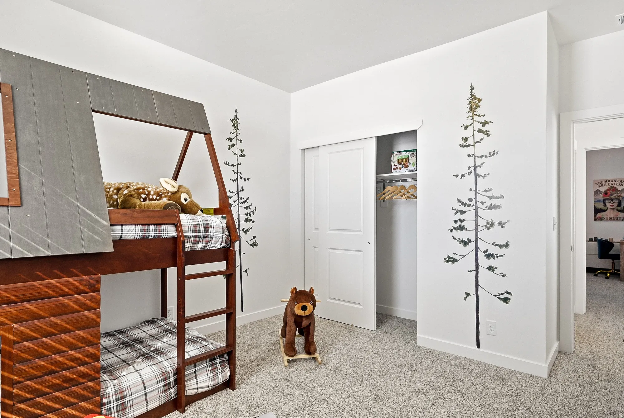 Bedroom with light carpet and a closet