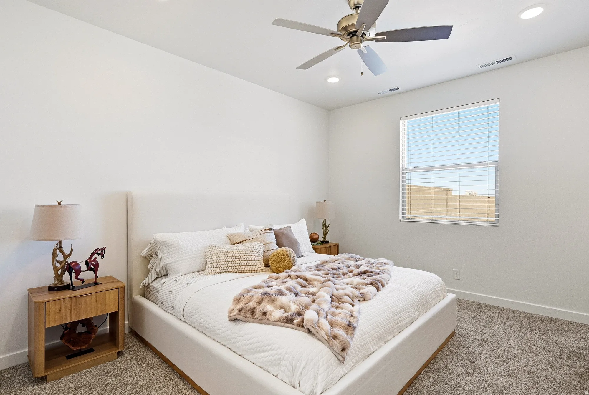 Carpeted bedroom featuring recessed lighting and ceiling fan