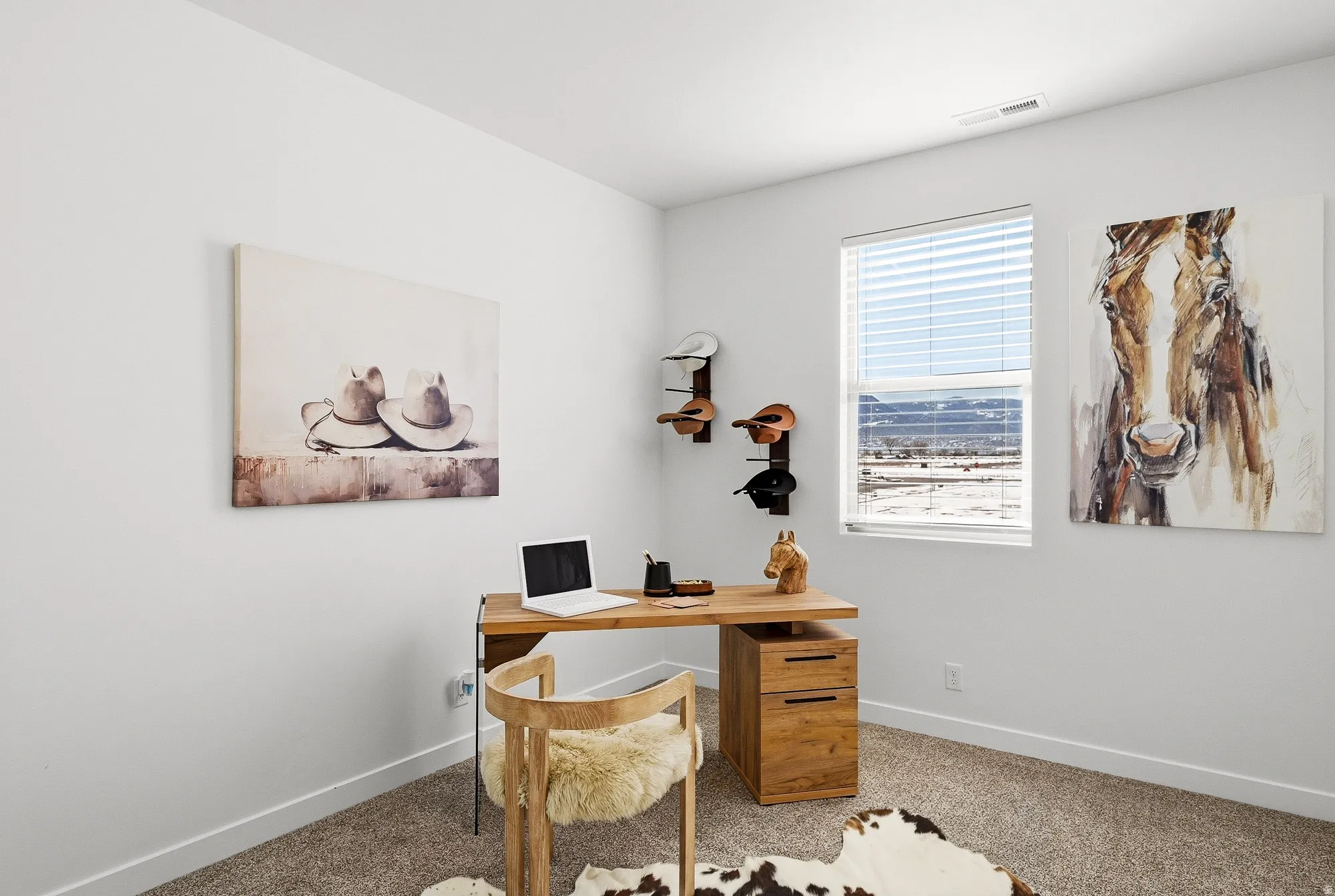 Office area featuring light carpet