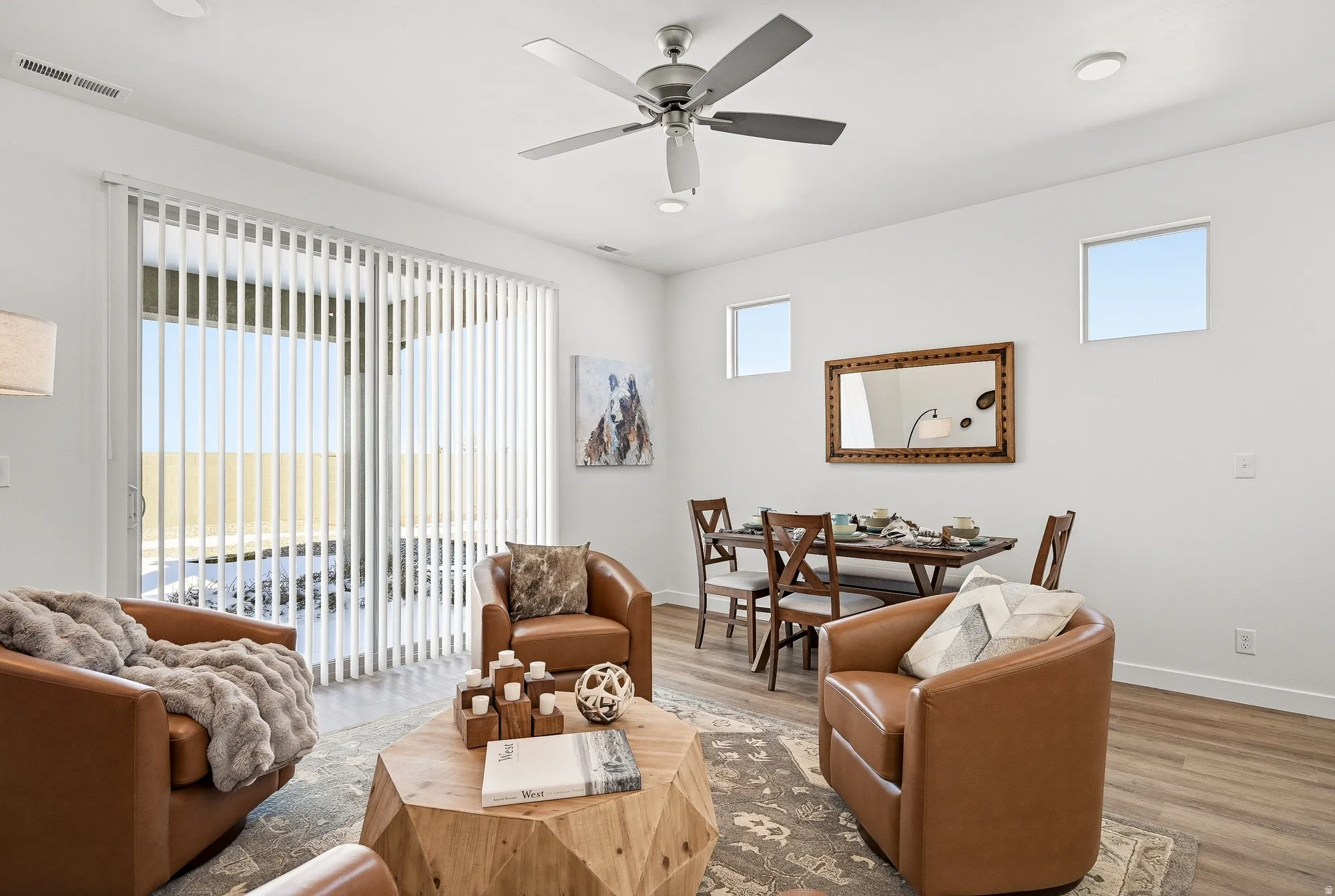 Living area featuring wood finished floors, a ceiling fan, and recessed lighting