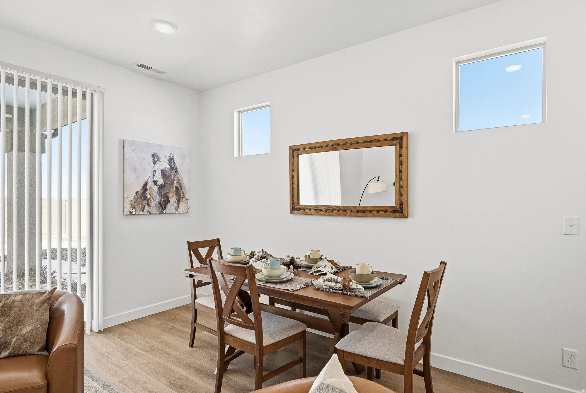 Dining area with light wood-type flooring