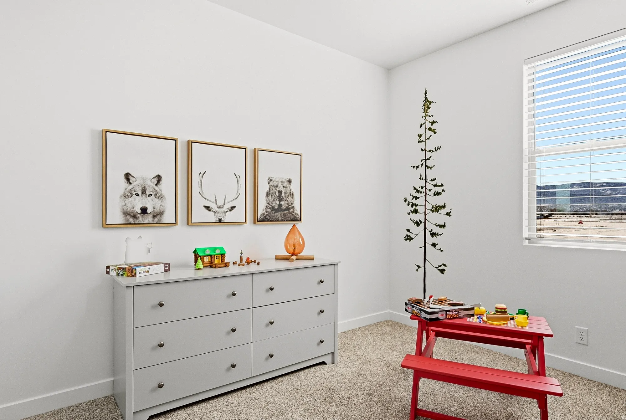 Playroom featuring baseboards and light colored carpet