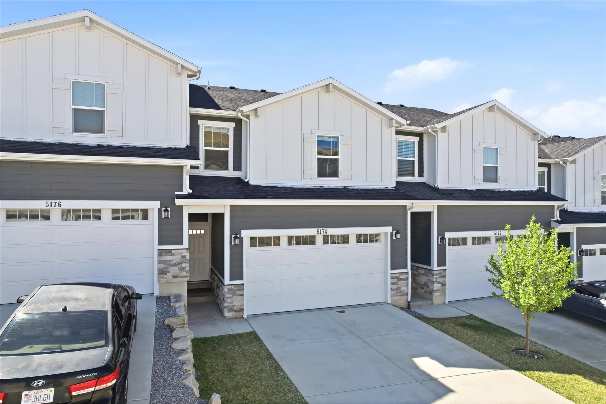 View of front of home with board and batten siding and stone siding