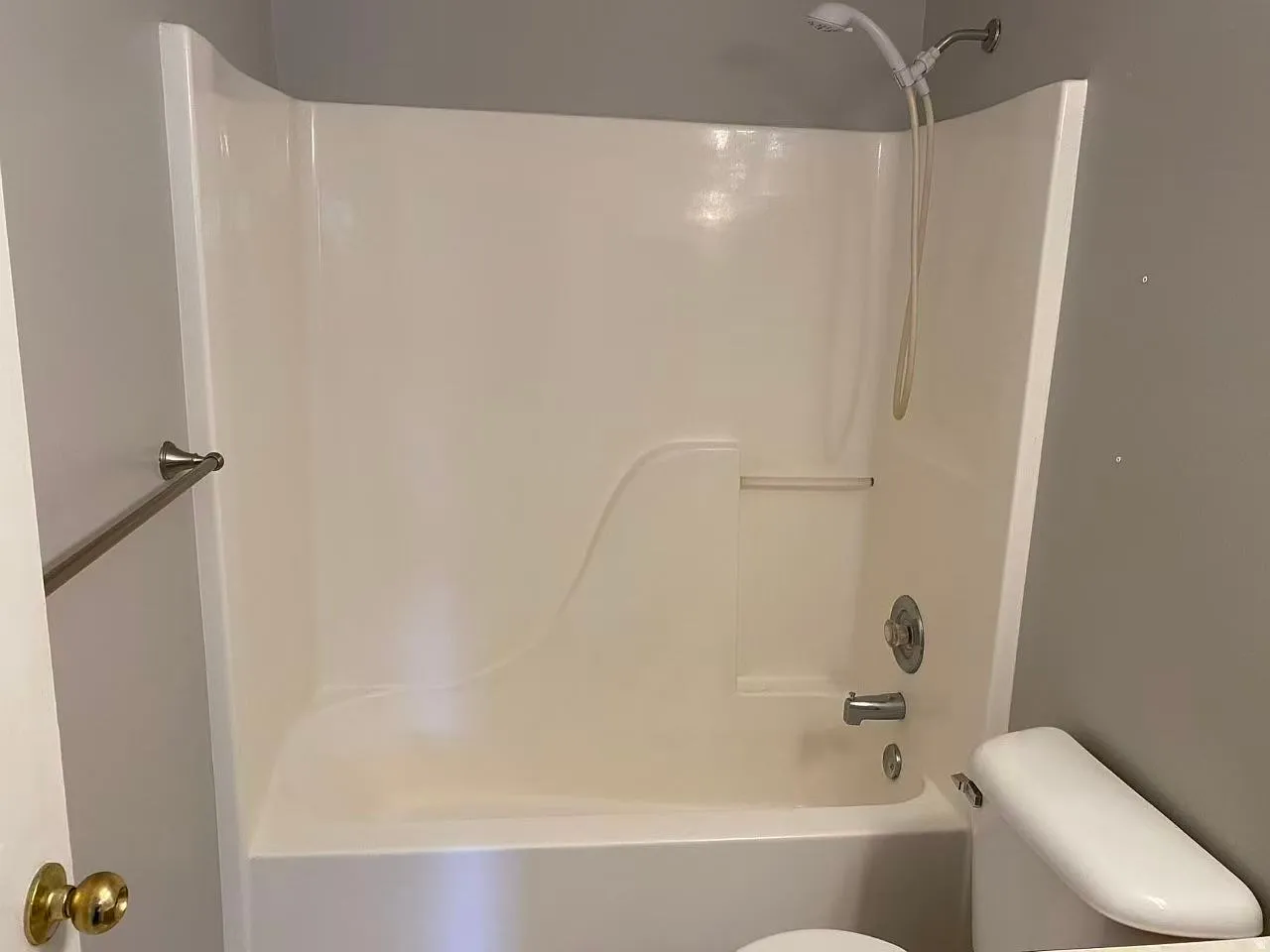 Bathroom with toilet and tub / shower combination