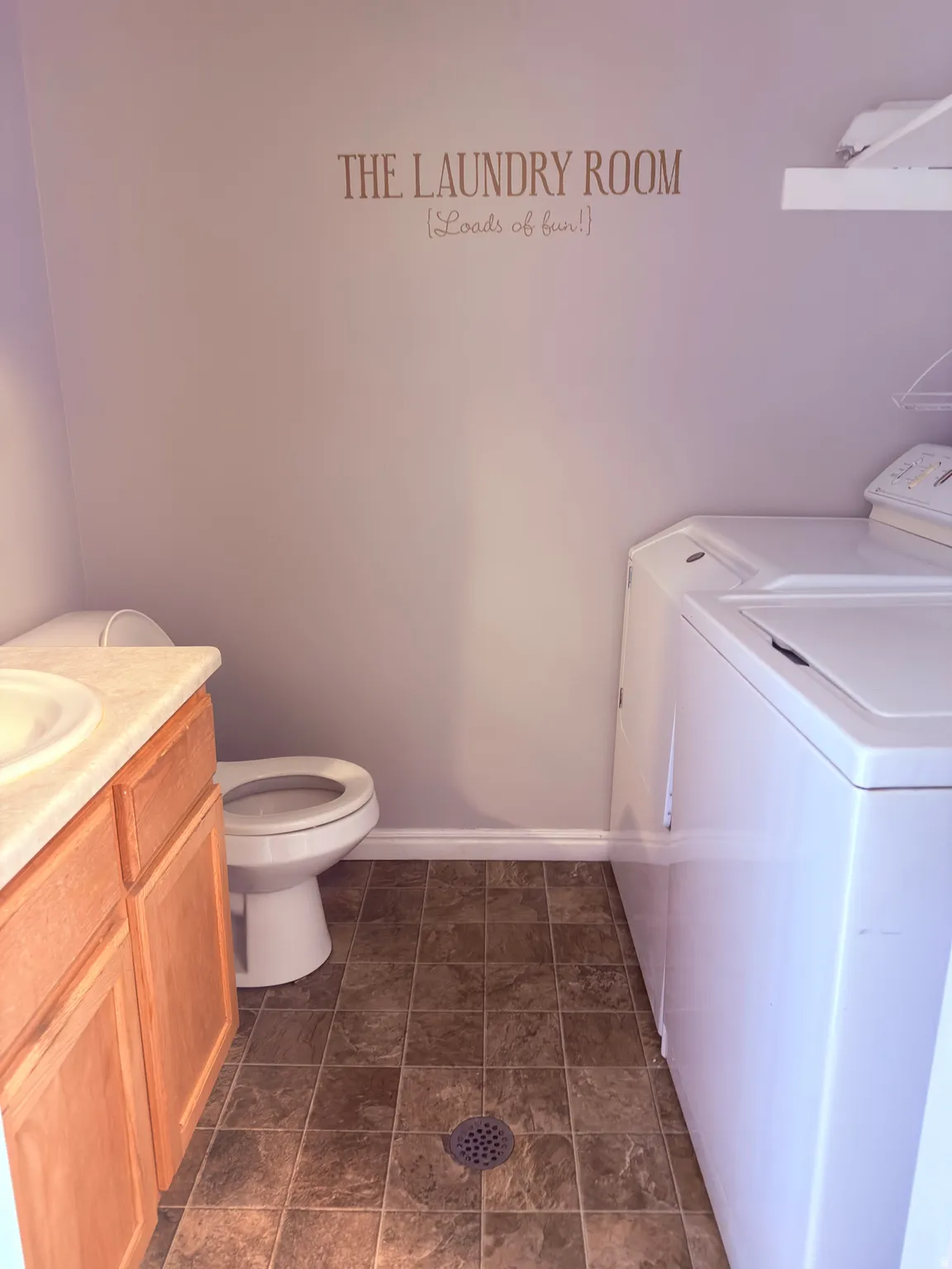 Bathroom featuring vanity and washer and dryer