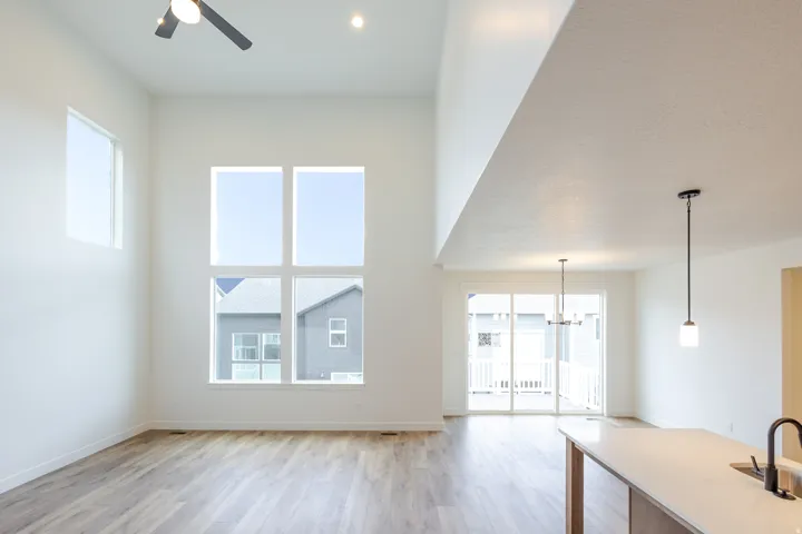 Vaulted ceilings featuring recessed lighting and a ceiling fan