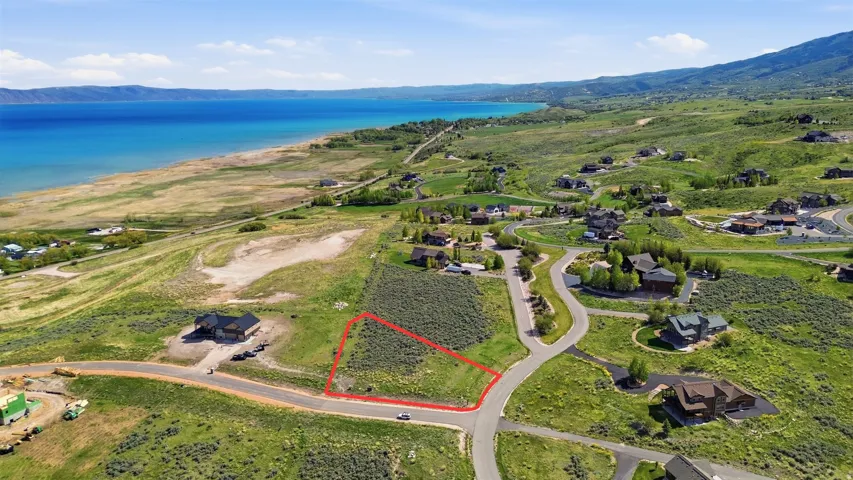 Expansive undeveloped lot featuring a natural landscape and paved road frontage