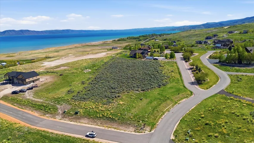 Elevated lot with panoramic waterfront and mountain backdrop